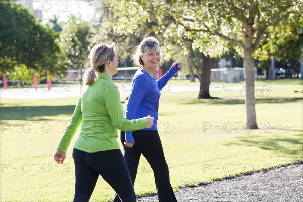 Caucasian women walking in park