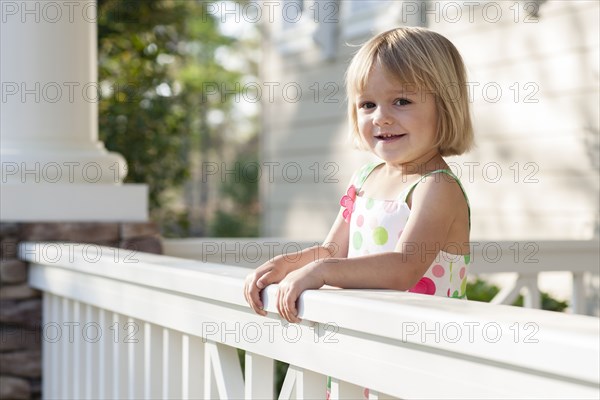 Caucasian girl standing on patio