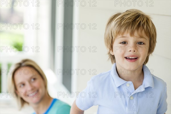 Caucasian mother and son on patio