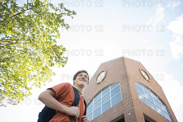 Low angle view of Caucasian teenage boy walking outdoors