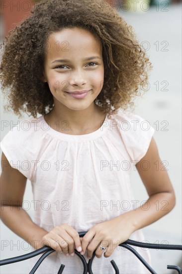 Mixed race girl smiling outdoors