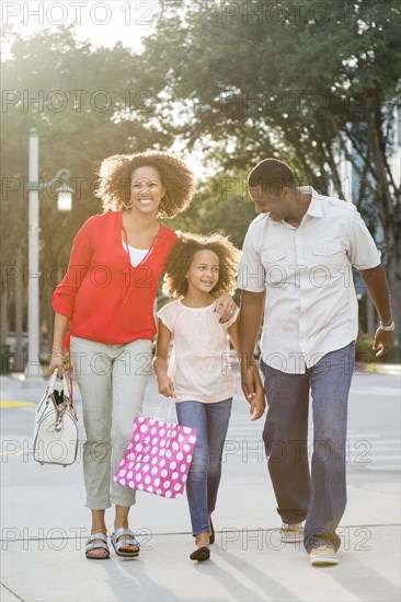 Smiling family walking outdoors