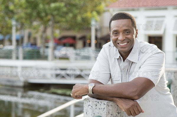 Black man smiling at marina