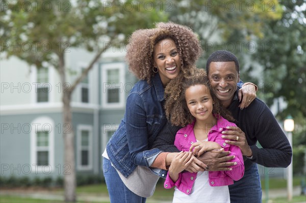 Family smiling outdoors