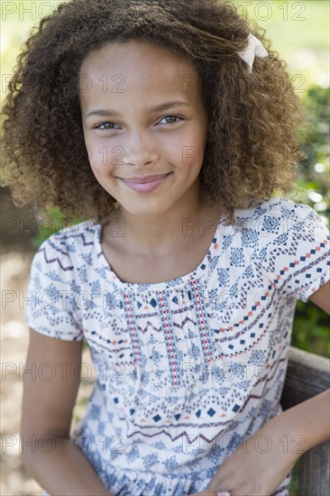 Mixed race girl smiling outdoors