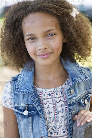 Mixed race girl smiling outdoors