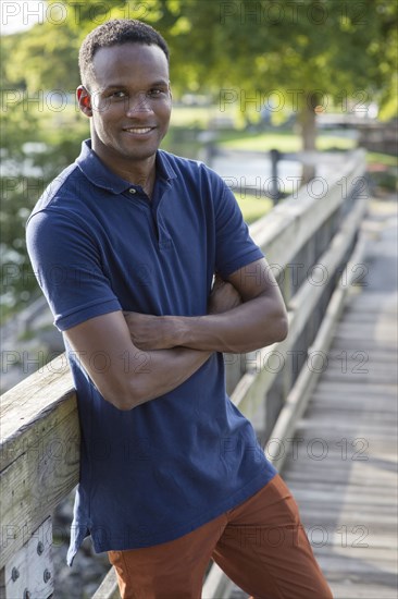 Black man smiling outdoors