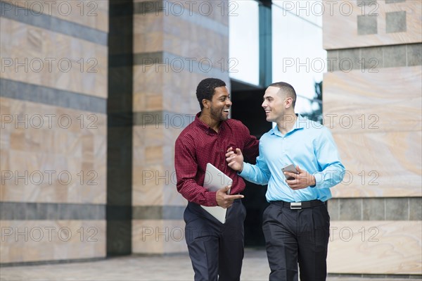 Businessmen talking outdoors