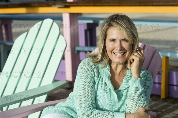 Older Caucasian woman sitting in lawn chair