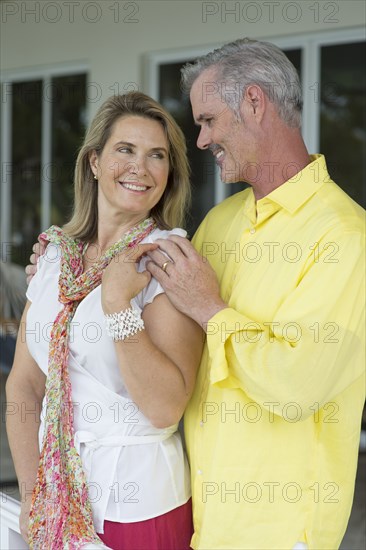 Older Caucasian woman hugging outdoors