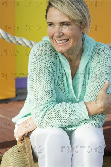 Older Caucasian woman sitting outdoors