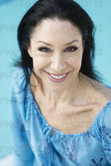 Caucasian woman sitting poolside