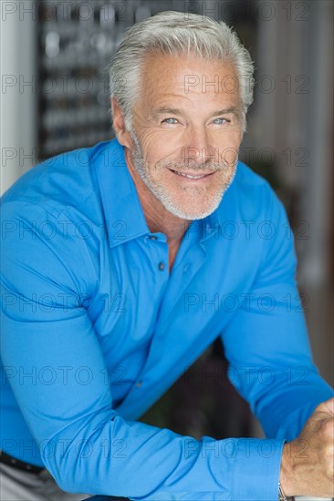 Smiling Caucasian man leaning