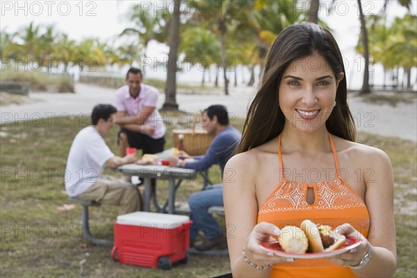 Hispanic friends enjoying barbecue