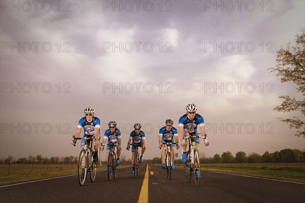 Competitive bicyclists racing on remote rode