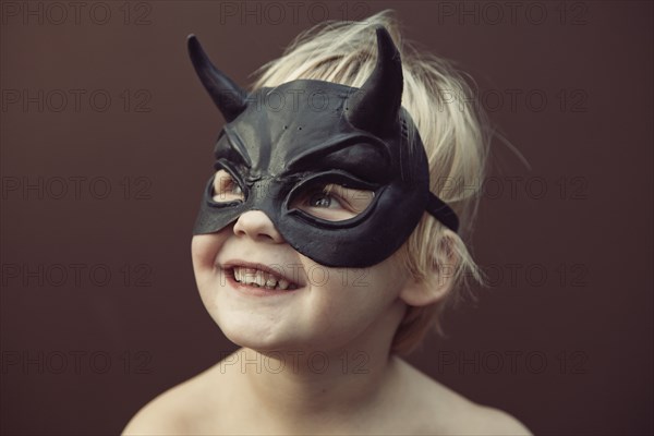 Caucasian boy wearing mask