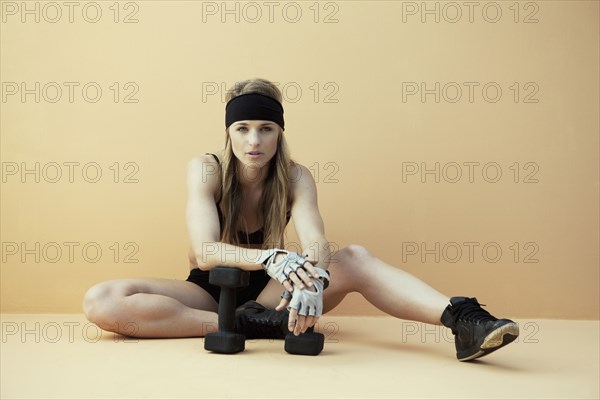 Caucasian woman resting during workout