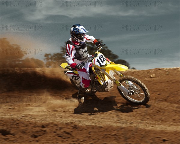 Caucasian dirt bike rider on course