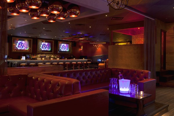 Tables and booths in empty nightclub