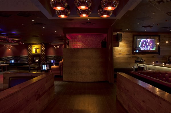 Tables and booths in empty nightclub