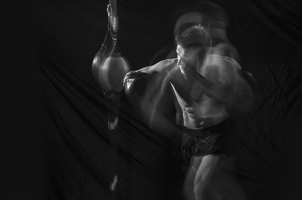 Blurred view of Caucasian boxer training