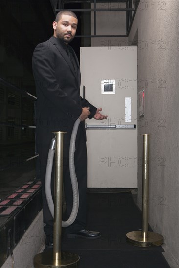 African American bouncer working at nightclub