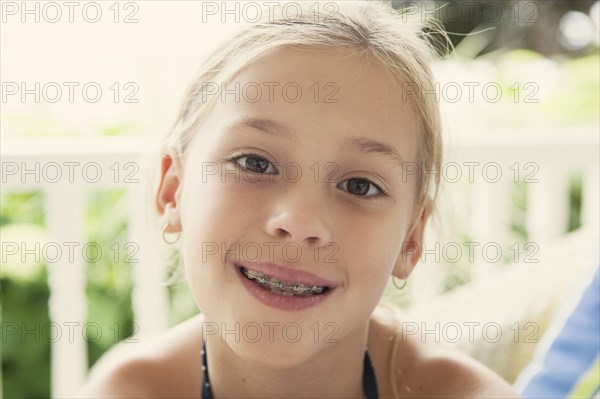 Caucasian girl smiling with braces