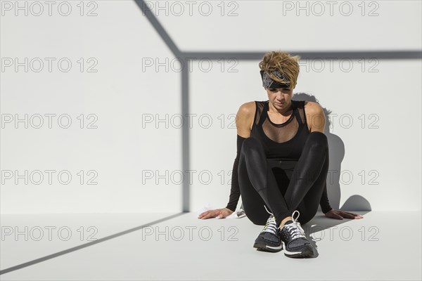 Caucasian athlete resting after workout