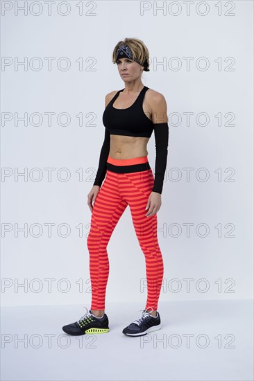 Caucasian athlete wearing colorful leggings