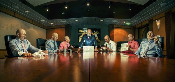 Multiple exposure of Caucasian businessmen in conference room