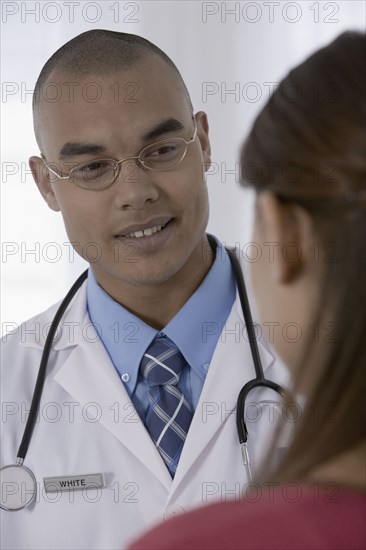 Male doctor talking to patient