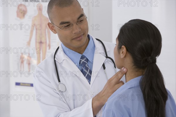 Male doctor examining patient