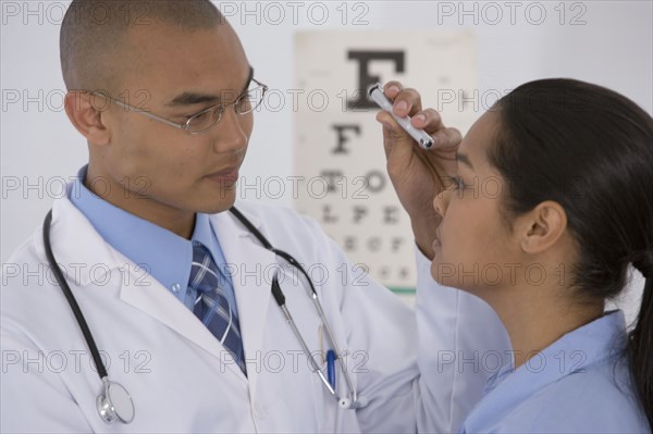 Male doctor examining patient