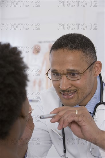 Female doctor putting on surgical gloves