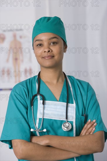 African female doctor with arms crossed