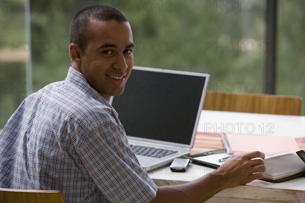 Young businessman working from home