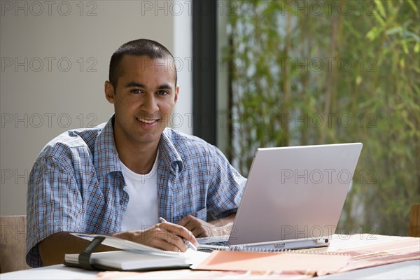 Young businessman working from home