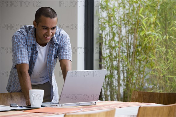 Young businessman working from home