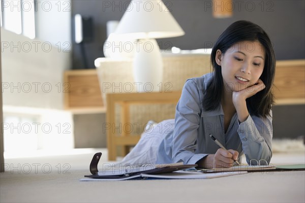 Asian businesswoman working on floor