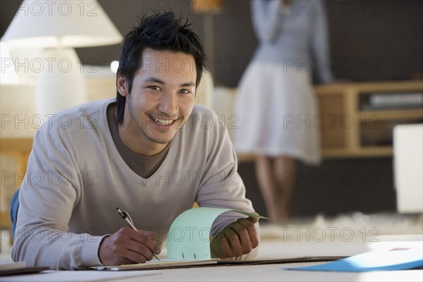 Asian businessman working on floor