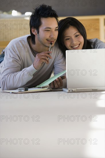 Asian businessman working on floor