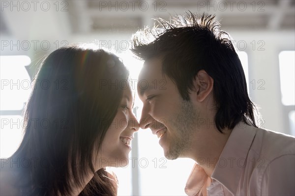 Asian couple touching noses