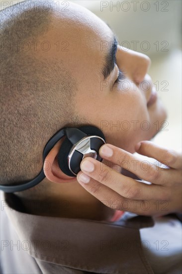 African American man listening to headphones