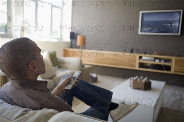 African American man watching television