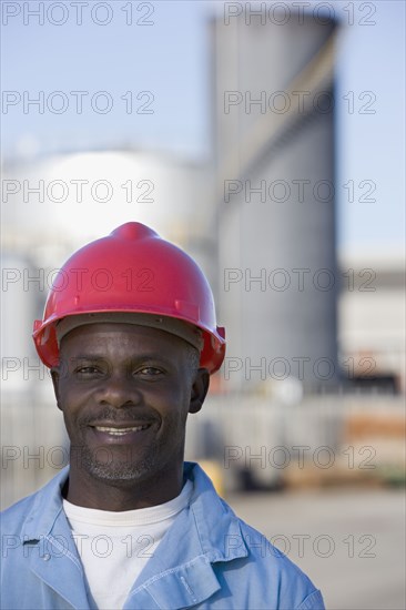 African American male construction worker wearing hardhat