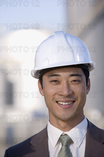 Asian businessman wearing hardhat