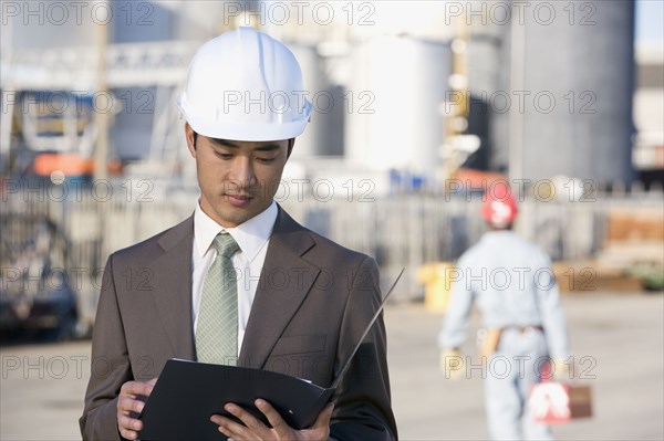 Asian businessman wearing hardhat