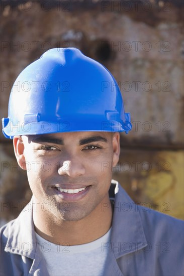 African American male construction worker wearing hardhat