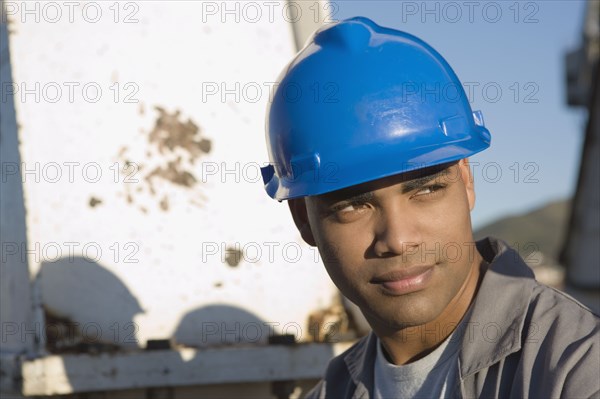 African American male construction worker wearing hardhat