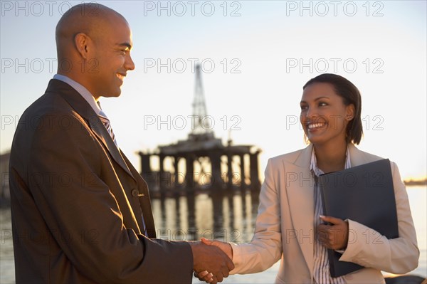 African American businesspeople shaking hands